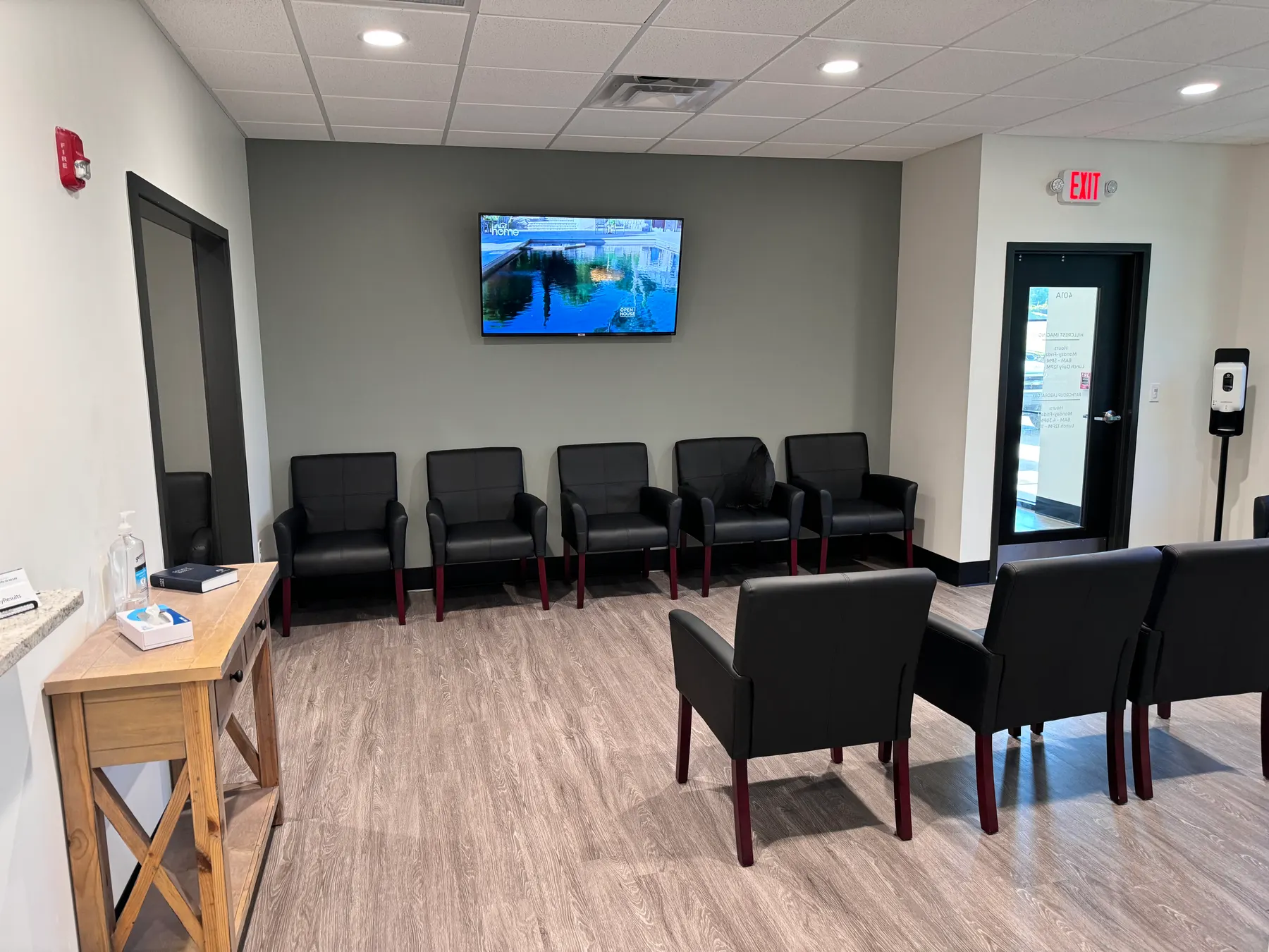 The waiting area of a modern dental office with rows of chairs